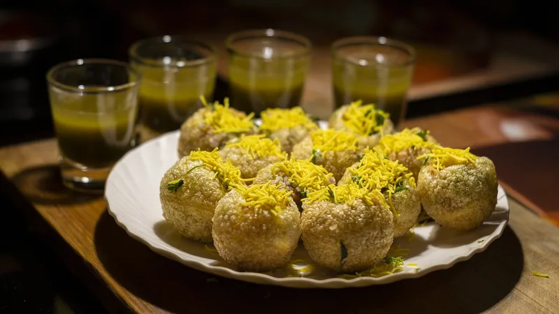 Live chaat station at an Indian event with assorted street food items