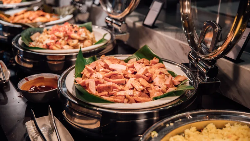 South Indian catering spread with copper serving trays and traditional dishes